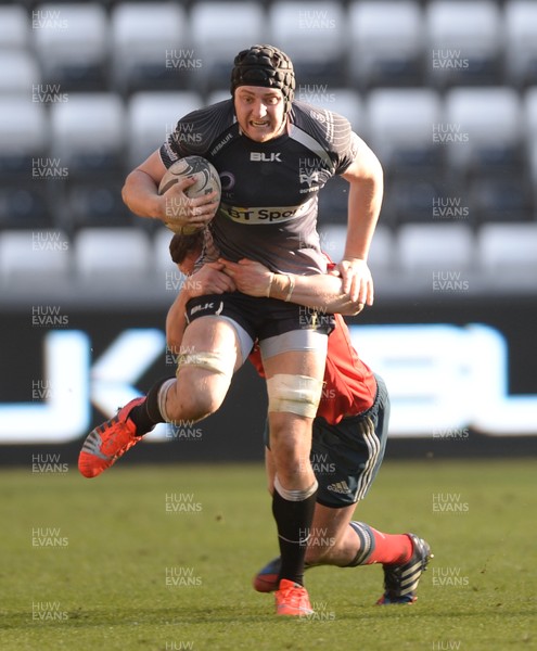 070315 - Ospreys v Munster - Guinness PRO12 -James King of Ospreys is tackled by Denis Hurley of Munster