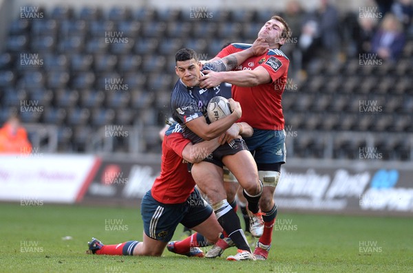 070315 - Ospreys v Munster - Guinness PRO12 -Josh Matavesi of Ospreys is tackled by Denis Hurley and CJ Stander of Munster