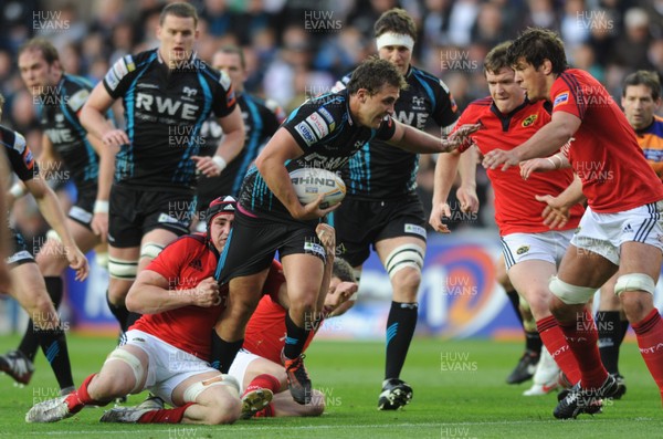 110512 - Ospreys v Munster - RaboDirect PRO12 Play-Off Semi Final -Ashley Beck of Ospreys is tackled by Tommy O'Donnell of Munster