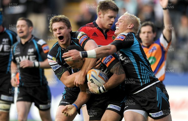 110512 - Ospreys v Munster - RaboDirect PRO12 Play-Off Semi Final -Kahn Fotuali'i of Ospreys celebrates his try with Dan Biggar and Hanno Dirksen