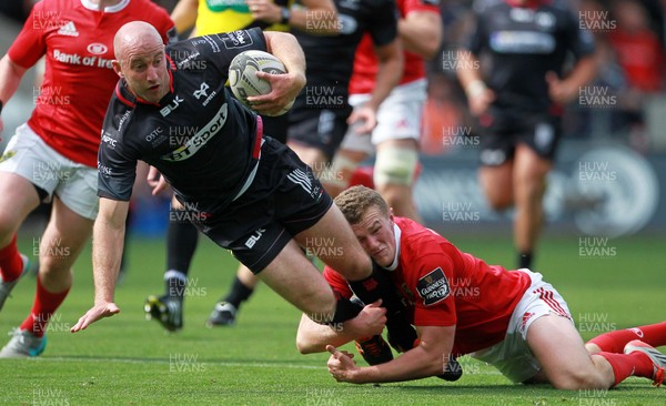 130915 - Ospreys v Munster - Guinness PRO12 - Brendon Leonard of Ospreys is tackled by Rory Scannell of Munster