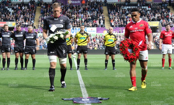 130915 - Ospreys v Munster, Guinness PRO12 - Lloyd Ashley, captain of the Ospreys and Felix Jones captain of Munster lay wreaths on the number 6 shirt of former All Black and Ospreys player Jerry Collins who died during the summer 