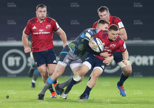 161119 - Ospreys v Munster, Heineken Champions Cup - Andrew Conway of Munster is tackled by Tom Williams of Ospreys