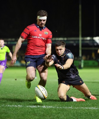 201225 - Ospreys v Munster, United Rugby Championship - Shane Daly of Munster kicks the ball clear to deny Max Nagy of Ospreys the chance to score
