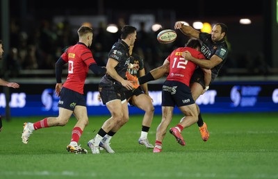 201225 - Ospreys v Munster, United Rugby Championship - Evardi Boshoff of Ospreys releases the ball as he’s tackled