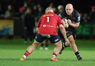 201225 - Ospreys v Munster, United Rugby Championship - Rhys Henry of Ospreys takes on Jeremy Loughman of Munster