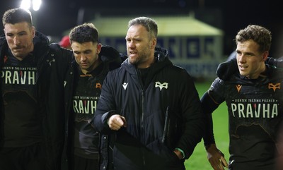 201225 - Ospreys v Munster, United Rugby Championship - Ospreys head coach Mark Jones speaks to the players at the end of the match
