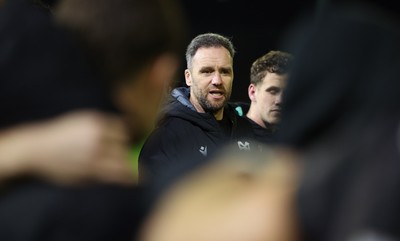 201225 - Ospreys v Munster, United Rugby Championship - Ospreys head coach Mark Jones speaks to the players at the end of the match