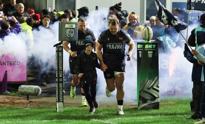 201225 - Ospreys v Munster, United Rugby Championship - Dewi Lake of Ospreys with match mascot