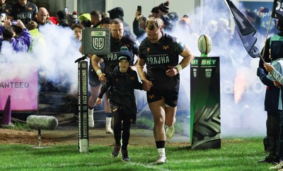 201225 - Ospreys v Munster, United Rugby Championship - Dewi Lake of Ospreys with match mascot