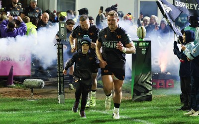 201225 - Ospreys v Munster, United Rugby Championship - Dewi Lake of Ospreys with match mascot