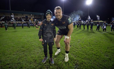 201225 - Ospreys v Munster, United Rugby Championship - Dewi Lake of Ospreys with match mascot