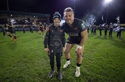 201225 - Ospreys v Munster, United Rugby Championship - Dewi Lake of Ospreys with match mascot