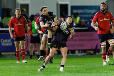 201225 - Ospreys v Munster - United Rugby Championship - Dan Edwards and Reuben Morgan-Williams of Ospreys go up for a high ball