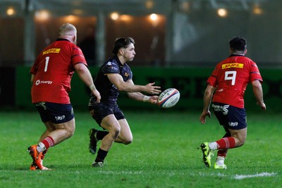 201225 - Ospreys v Munster - United Rugby Championship - Dan Edwards of Ospreys passes the ball