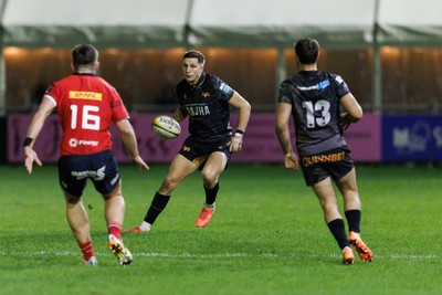 201225 - Ospreys v Munster - United Rugby Championship - Max Nagy of Ospreys takes on Lee Barron of Munster