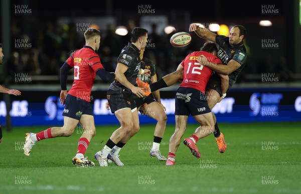 201225 - Ospreys v Munster, United Rugby Championship - Evardi Boshoff of Ospreys releases the ball as he’s tackled