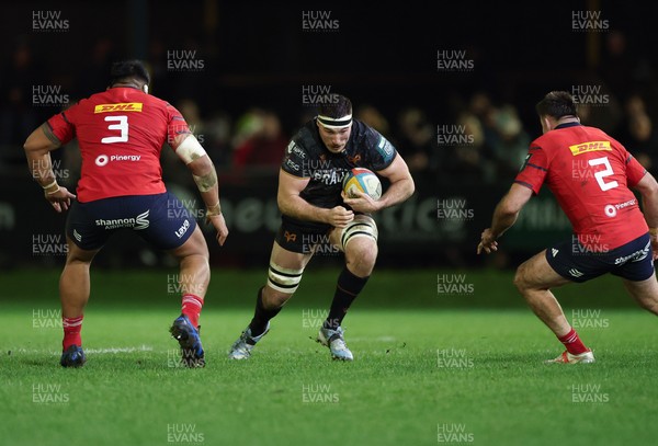 201225 - Ospreys v Munster, United Rugby Championship - Ryan Smith of Ospreys takes on Niall Scannell of Munster and Michael Ala’alatoa of Munster