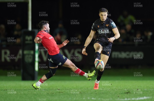 201225 - Ospreys v Munster, United Rugby Championship - Max Nagy of Ospreys kicks the ball through