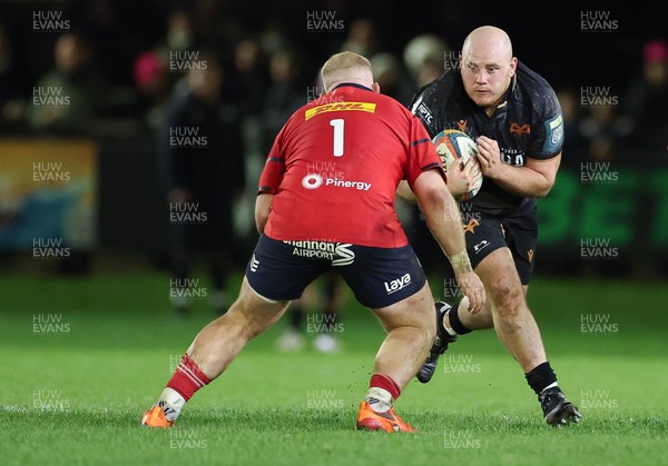 201225 - Ospreys v Munster, United Rugby Championship - Rhys Henry of Ospreys takes on Jeremy Loughman of Munster