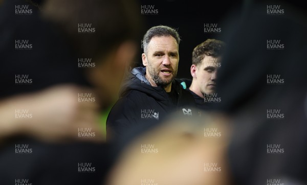 201225 - Ospreys v Munster, United Rugby Championship - Ospreys head coach Mark Jones speaks to the players at the end of the match