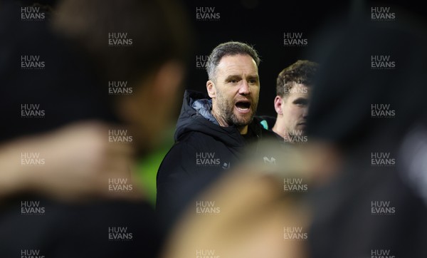 201225 - Ospreys v Munster, United Rugby Championship - Ospreys head coach Mark Jones speaks to the players at the end of the match