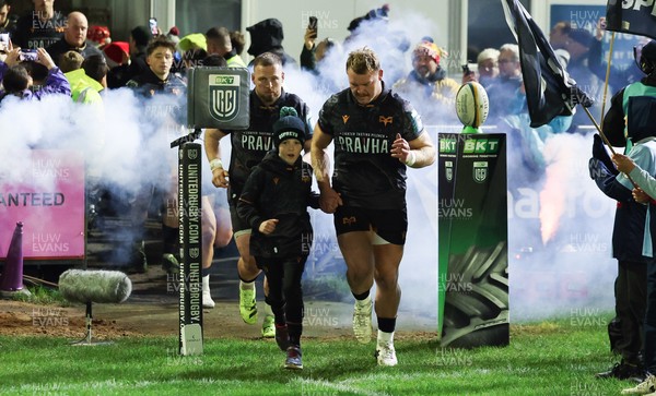 201225 - Ospreys v Munster, United Rugby Championship - Dewi Lake of Ospreys with match mascot