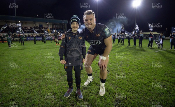 201225 - Ospreys v Munster, United Rugby Championship - Dewi Lake of Ospreys with match mascot