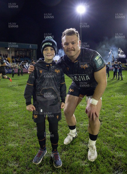 201225 - Ospreys v Munster, United Rugby Championship - Dewi Lake of Ospreys with match mascot