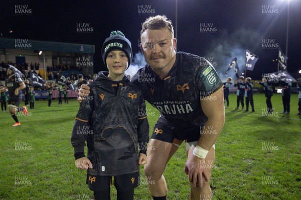 201225 - Ospreys v Munster, United Rugby Championship - Dewi Lake of Ospreys with match mascot