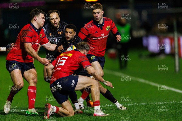 201225 - Ospreys v Munster - United Rugby Championship - Keelan Giles of Ospreys is tackled by Mike Haley of Munster