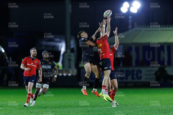 201225 - Ospreys v Munster - United Rugby Championship - Max Nagy of Ospreys and Shane Daly of Munster compete for the ball
