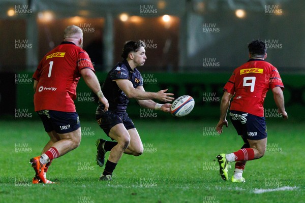 201225 - Ospreys v Munster - United Rugby Championship - Dan Edwards of Ospreys passes the ball