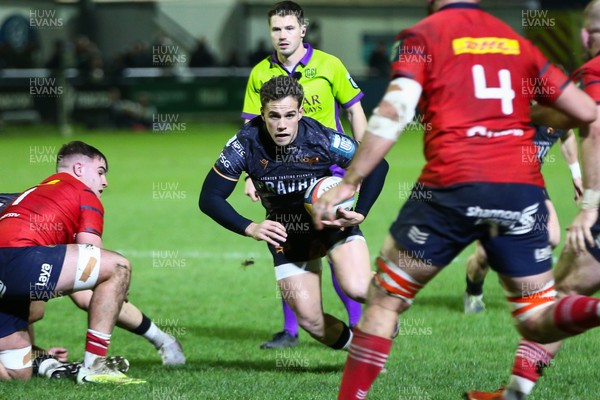 201225 - Ospreys v Munster - United Rugby Championship - Kieran Hardy of Ospreys looks for a gap