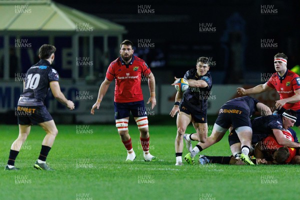 201225 - Ospreys v Munster - United Rugby Championship - Reuben Morgan-Williams of Ospreys passes the ball