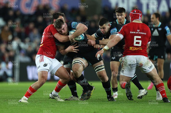 220324 - Ospreys v Munster - United Rugby Championship - James Ratti of Ospreys is tackled by Joey Carbery of Munster 