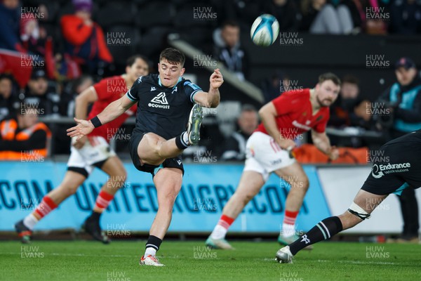 220324 - Ospreys v Munster - United Rugby Championship - Reuben Morgan-Williams of Ospreys kicks the ball