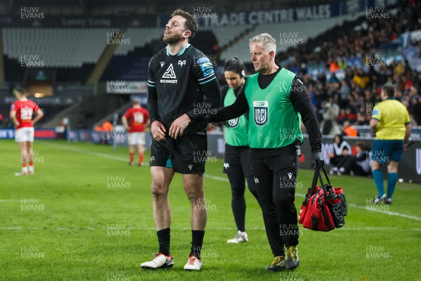 220324 - Ospreys v Munster - United Rugby Championship - Alex Cuthbert of Ospreys leaves the field injured