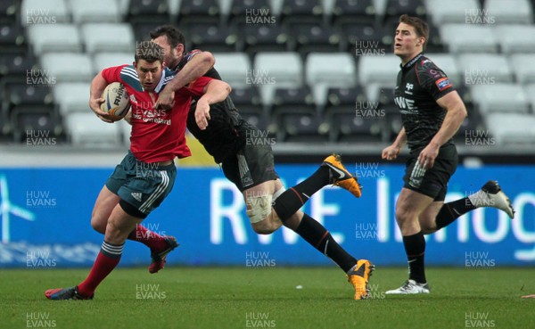 230214 - Ospreys v Munster - RaboDirect PRO12 - Ian Keatley of Munster is tackled by Ashley Beck of Ospreys 