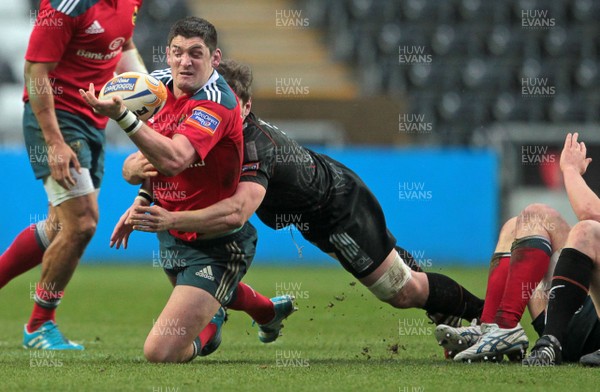 230214 - Ospreys v Munster - RaboDirect PRO12 - James Downey of Munster is tackled by Jeffrey Hassler of Ospreys 