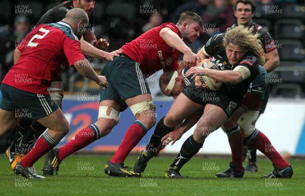 230214 - Ospreys v Munster - RaboDirect PRO12 - Duncan Jones of Ospreys gets past James Coughlan of Munster 