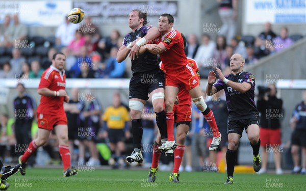 23.04.11 - Ospreys v Munster - Magners League - Alun Wyn Jones of Ospreys and Felix Jones of Munster compete for high ball. 