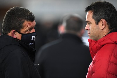 231021 - Ospreys v Munster - United Rugby Championship - Ospreys head coach Toby Booth and Munster head coach Johann Christoffel van Graan ahead of kick off