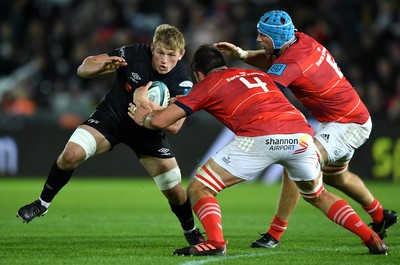 231021 - Ospreys v Munster - United Rugby Championship - Jac Morgan of Ospreys takes on Jean Kleyn and Tadhg Beirne of Munster