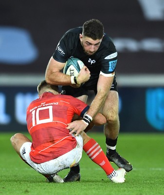 231021 - Ospreys v Munster - United Rugby Championship - Alex Cuthbert of Ospreys is tackled by Jack Crowley of Munster