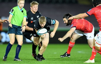 231021 - Ospreys v Munster - United Rugby Championship - Keiran Williams of Ospreys gets past Kevin O’Byrne of Munster