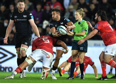 231021 - Ospreys v Munster - United Rugby Championship - Rhys Webb of Ospreys is tackled by Fineen Wycherley of Munster