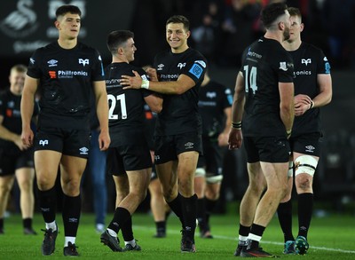 231021 - Ospreys v Munster - United Rugby Championship - Reuben Morgan-Williams and Max Nagy of Ospreys at the end of the game