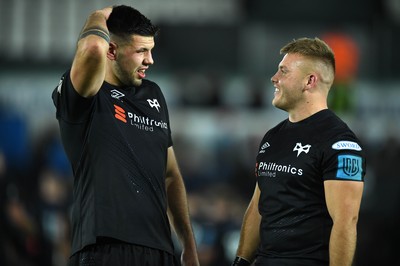 231021 - Ospreys v Munster - United Rugby Championship - Rhys Davies and Ifan Phillips of Ospreys at the end of the game