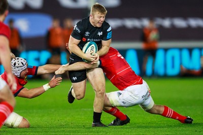 231021 - Ospreys v Munster - United Rugby Championship - Keiran Williams of Ospreys is tackled by